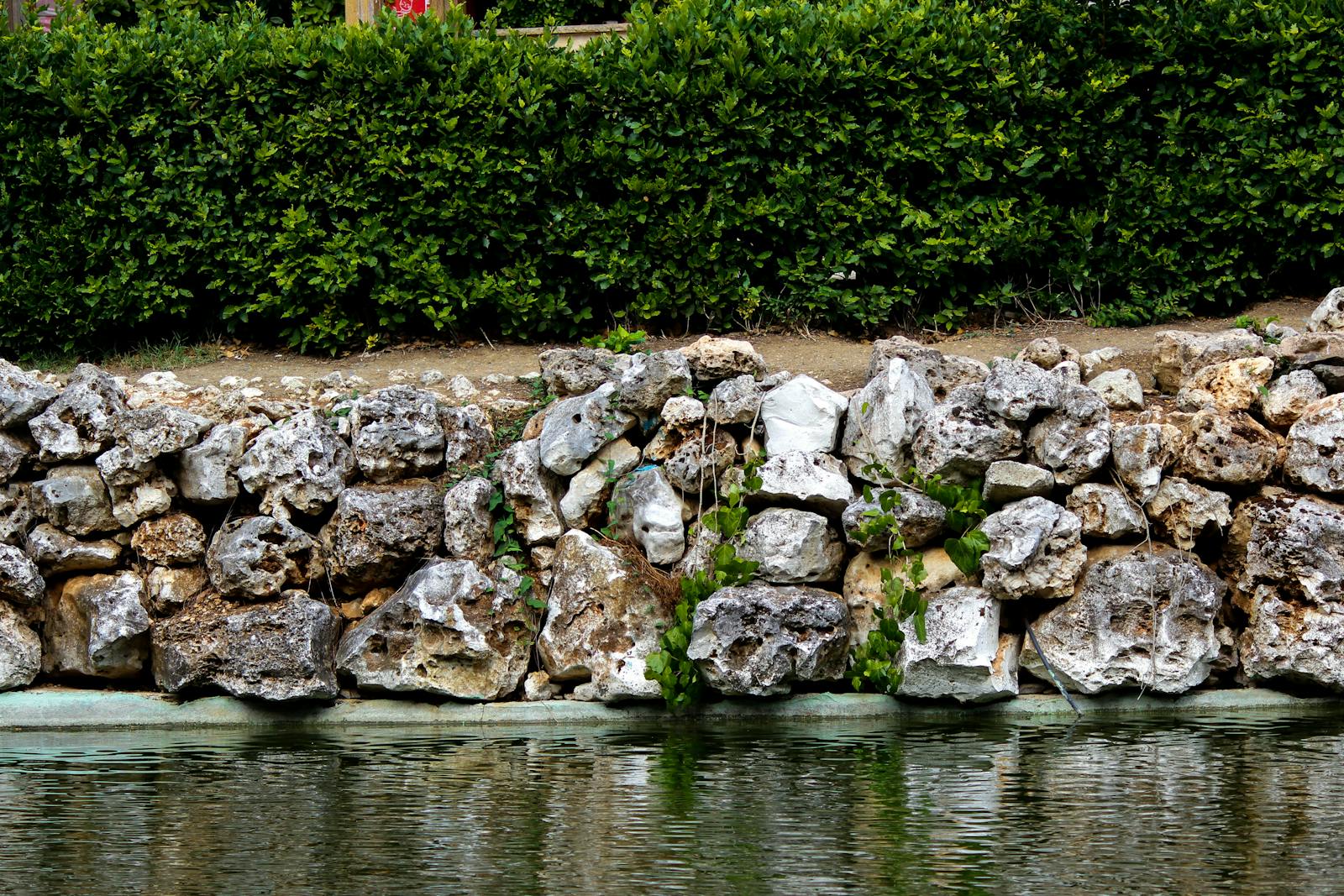 Block wall along a back-yard slope with planted bed